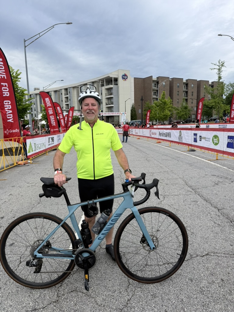 Randy in 2026 with his road bike at the Move for Grady charity ride in Atlanta